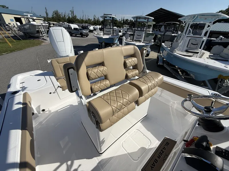 Slide: The Image of The image shows the cockpit of a Blazer Makaira 2600 with beige seating and controls. - 12