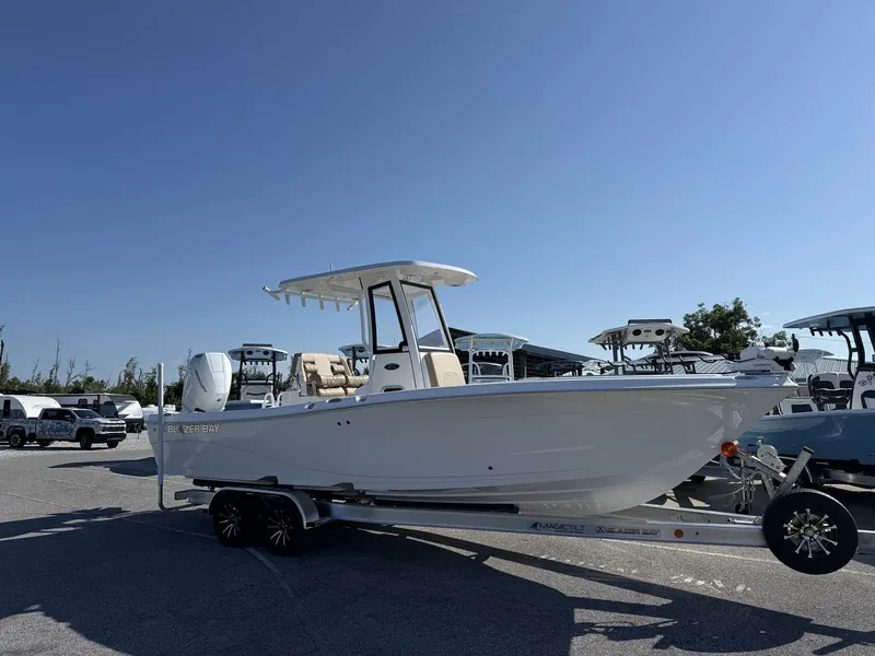 The Image of Blazer Makaira 2600-425HP MERCURY boat on a trailer outdoors. - 1