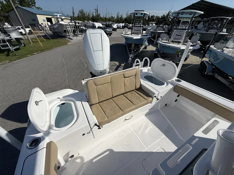 Slide: The Image of The image shows the deck of a Blazer Makaira 2600 with beige seating and storage compartments. - 15