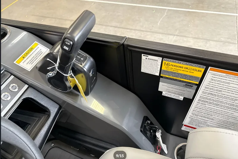Slide: The Image of Control panel of 2027 Godfrey Monaco 25' Tritoon with capacity warning labels. - 36