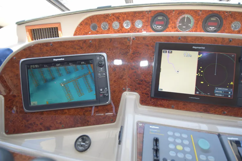 Slide: The Image of Navigation system on 1999 Bayliner 5288 Pilot House Motoryacht dashboard with Raymarine displays. - 13