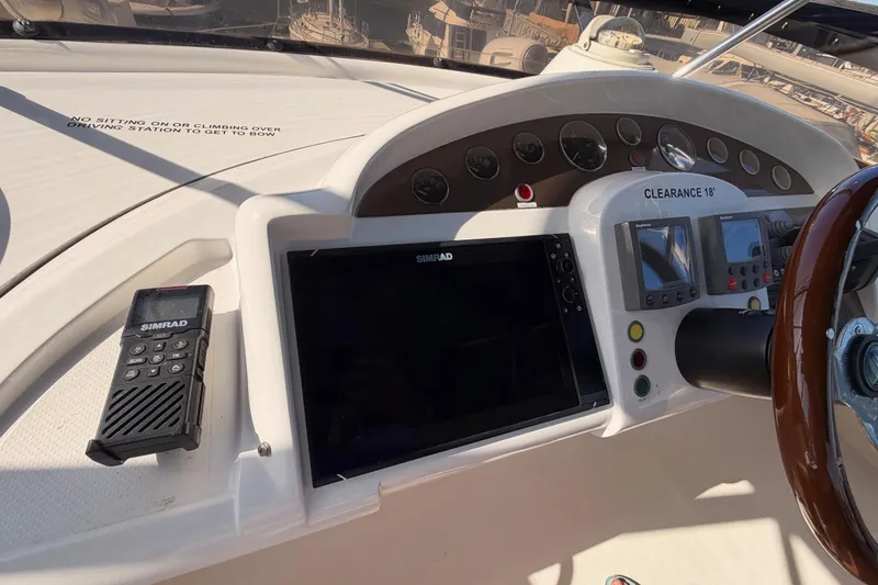 Slide: The Image of Control panel of a 2001 Fairline 55 yacht with Simrad navigation equipment. - 73