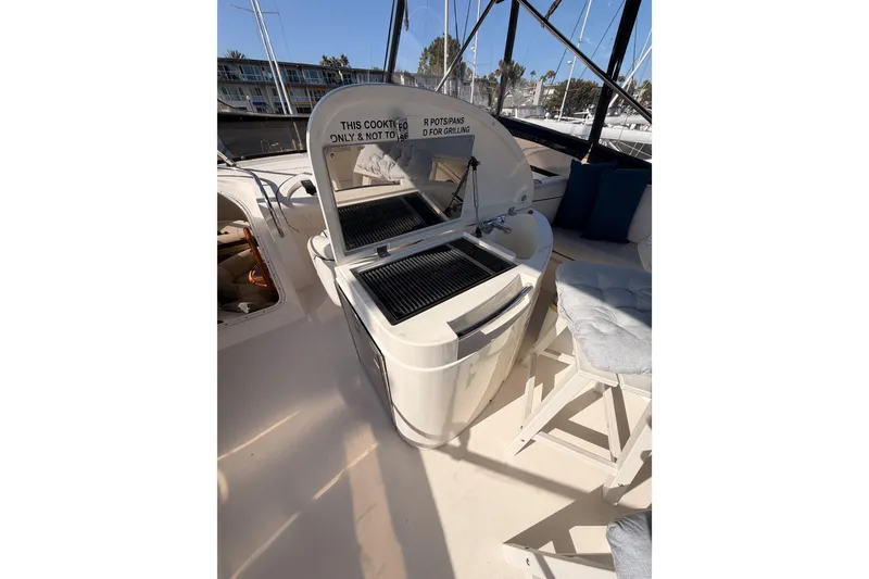 Slide: The Image of Outdoor grill and seating area on a 2001 Fairline 55 yacht. - 67