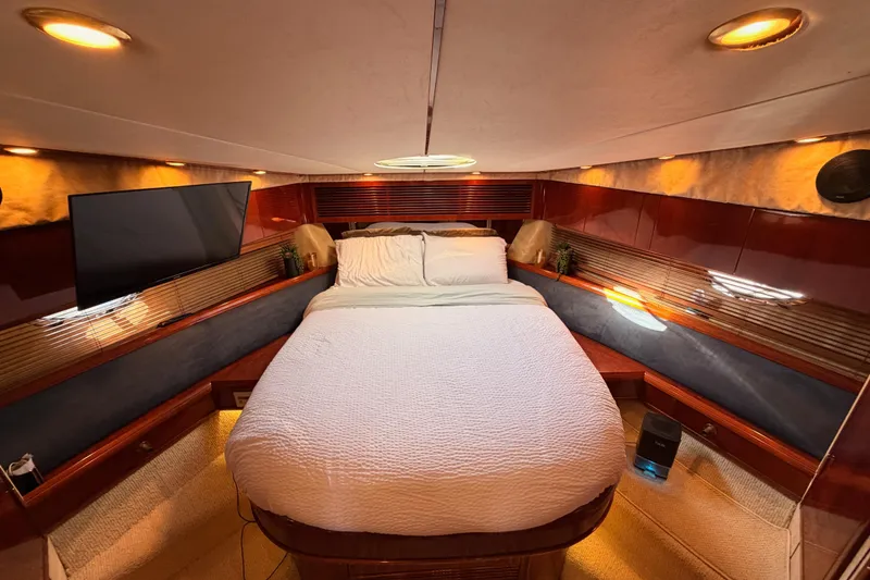 Slide: The Image of Luxurious cabin interior of 2001 Fairline 55 yacht with cozy bed and modern amenities. - 114