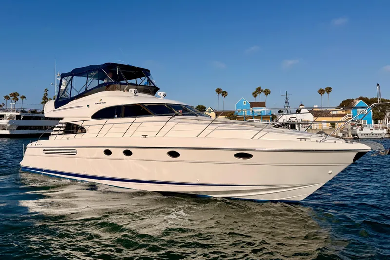 Slide: The Image of Luxury 2001 Fairline 55 yacht cruising in a scenic marina setting. - 137
