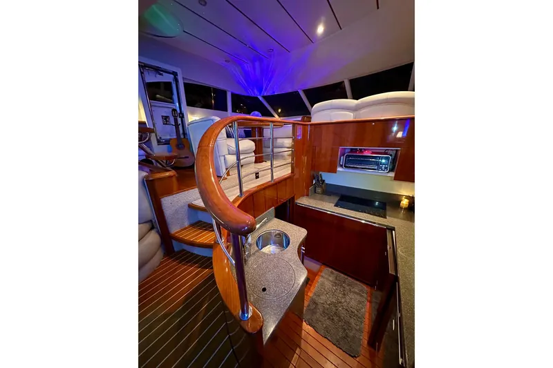 Slide: The Image of Luxurious interior of 2001 Fairline 55 yacht with elegant wood finishes and modern amenities. - 143