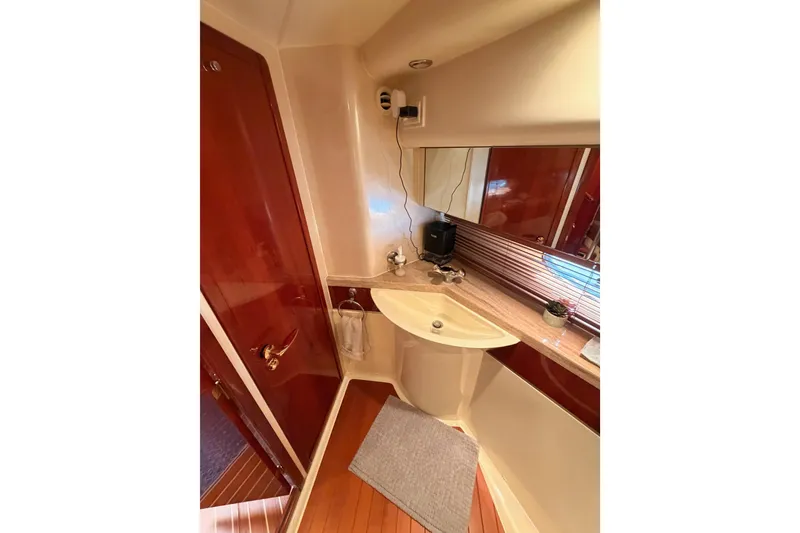 Slide: The Image of Luxurious bathroom interior of 2001 Fairline 55 yacht with elegant wood finishes. - 105