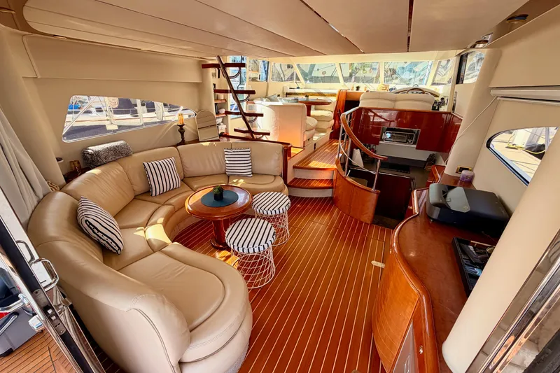 Slide: The Image of Luxurious interior of a 2001 Fairline 55 yacht with elegant seating and wooden finishes. - 22