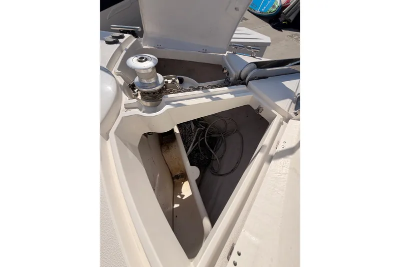 Slide: The Image of Anchor compartment of a 2001 Fairline 55 yacht, featuring chain and winch. - 53