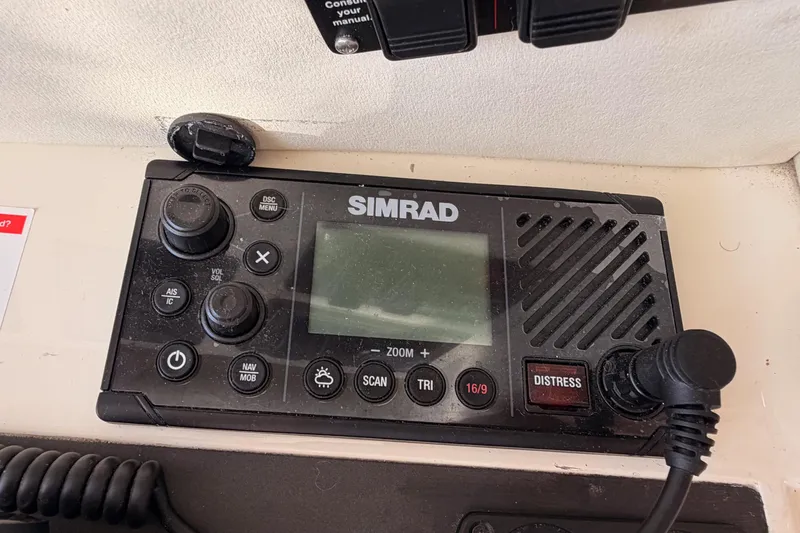 Slide: The Image of Simrad marine radio on 2001 Fairline 55 yacht dashboard. - 88