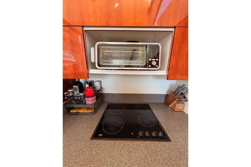 Slide: The Image of Modern kitchen in 2001 Fairline 55 yacht with stovetop and toaster oven. - 41