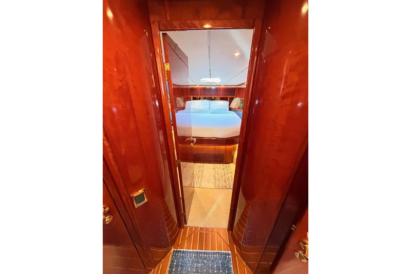 Slide: The Image of Luxurious cabin interior of 2001 Fairline 55 yacht with polished wood finish. - 113