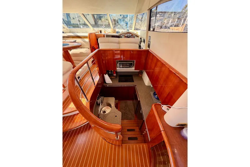 Slide: The Image of Luxurious interior of 2001 Fairline 55 yacht with elegant wood finishes and modern amenities. - 27