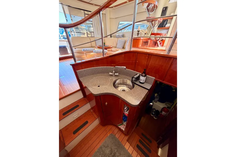 Slide: The Image of Luxurious 2001 Fairline 55 yacht interior with elegant wood finishes and modern amenities. - 32