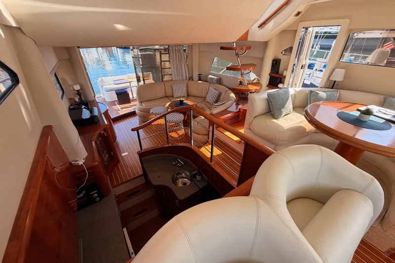 Slide: The Image of Luxurious interior of a 2001 Fairline 55 yacht with elegant seating and wooden finishes. - 91
