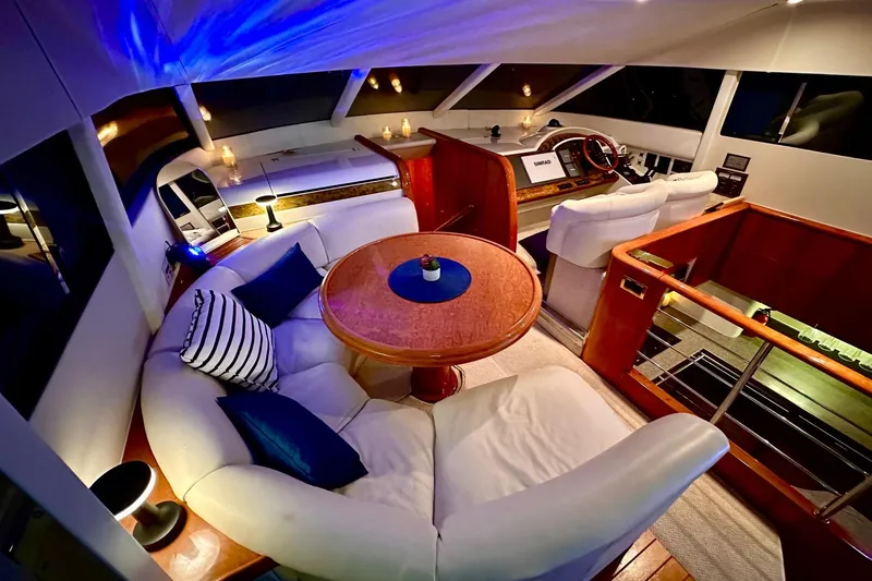 Slide: The Image of Luxurious interior of a 2001 Fairline 55 yacht with elegant seating and ambient lighting. - 148