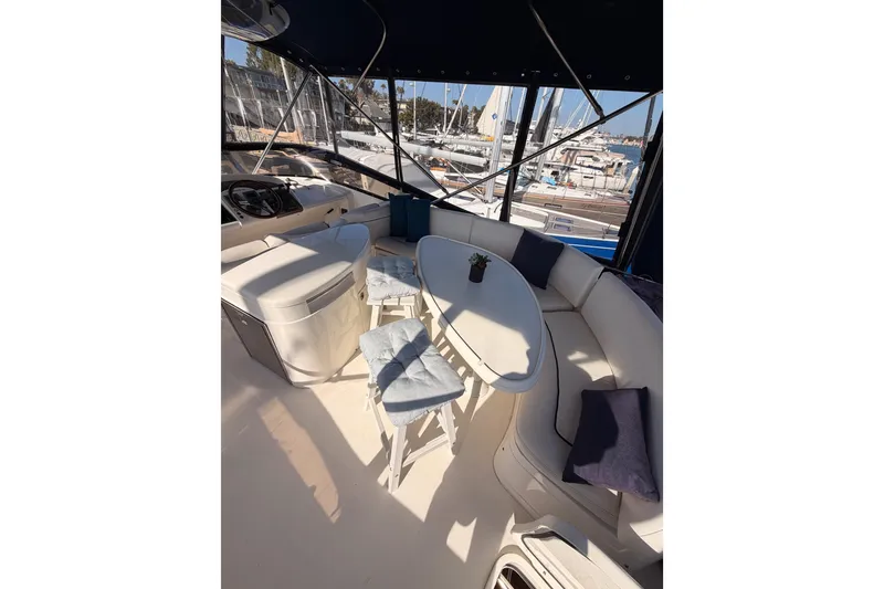 Slide: The Image of Luxurious 2001 Fairline 55 yacht interior with seating and marina view. - 65