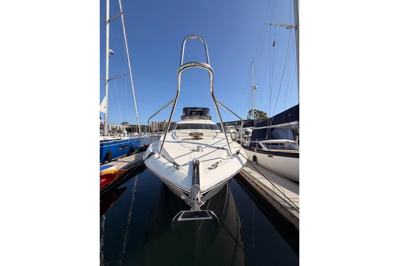 Slide: The Image of Front view of a 2001 Fairline 55 yacht docked at a marina. - 3