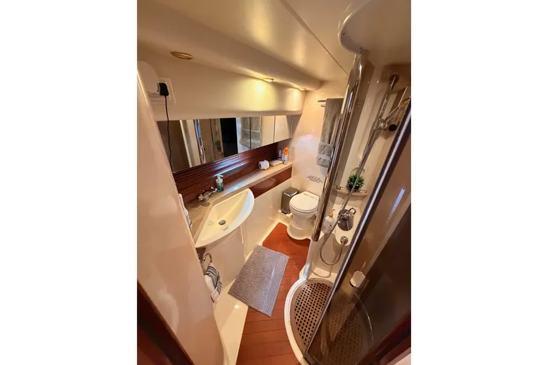 Slide: The Image of Luxurious bathroom in 2001 Fairline 55 yacht with modern fixtures and elegant design. - 120