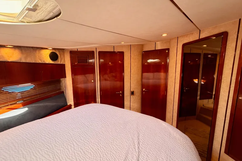Slide: The Image of Luxurious cabin interior of a 2001 Fairline 55 yacht with wood finishes. - 118