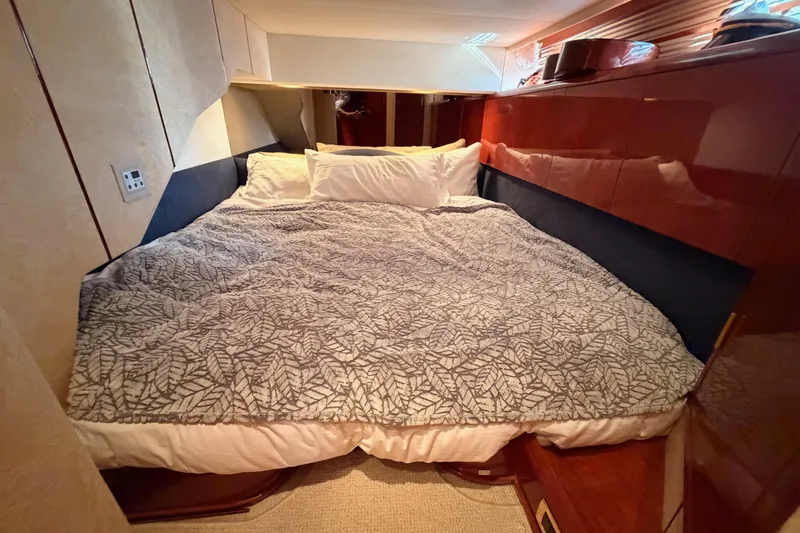 Slide: The Image of Luxurious cabin interior of a 2001 Fairline 55 yacht with cozy bedding. - 108