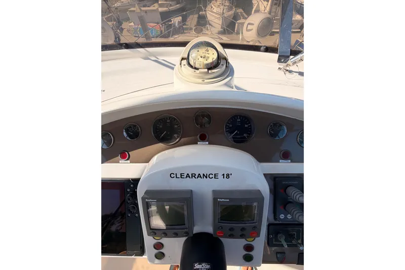 Slide: The Image of Cockpit view of 2001 Fairline 55 yacht with navigation instruments and compass. - 74
