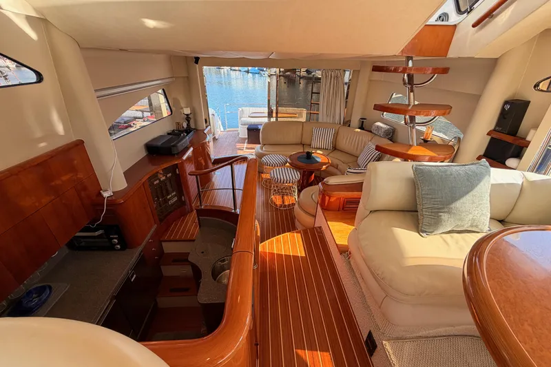 Slide: The Image of Luxurious 2001 Fairline 55 yacht interior with elegant wood finishes and comfortable seating. - 130