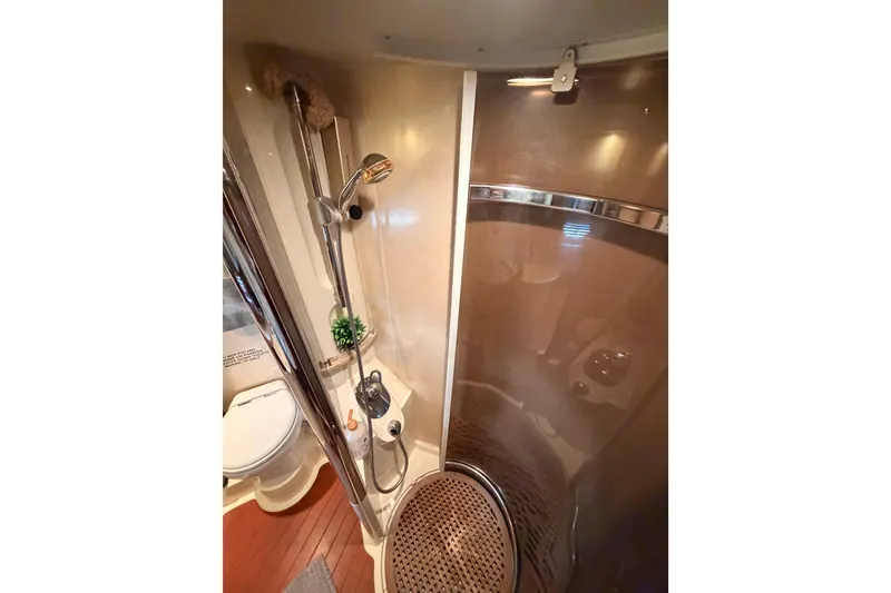 Slide: The Image of Bathroom interior of 2001 Fairline 55 yacht, featuring shower and toilet. - 124