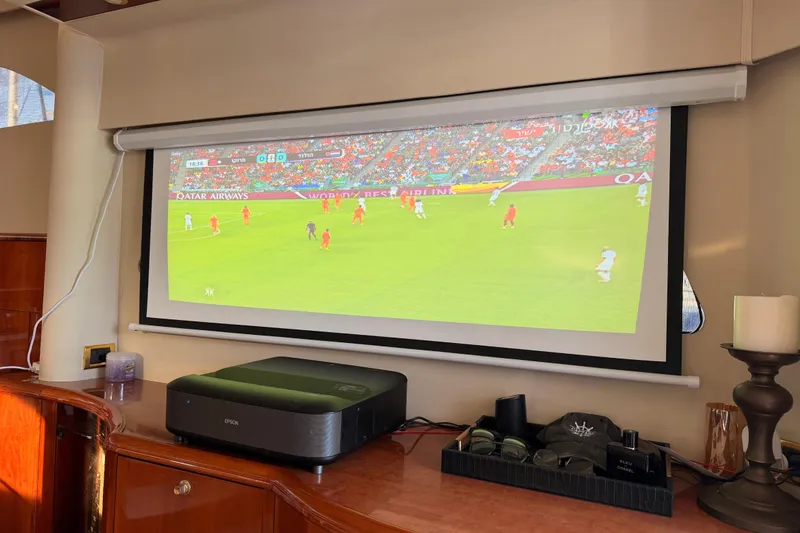 Slide: The Image of Projector displaying soccer match inside 2001 Fairline 55 yacht. - 25