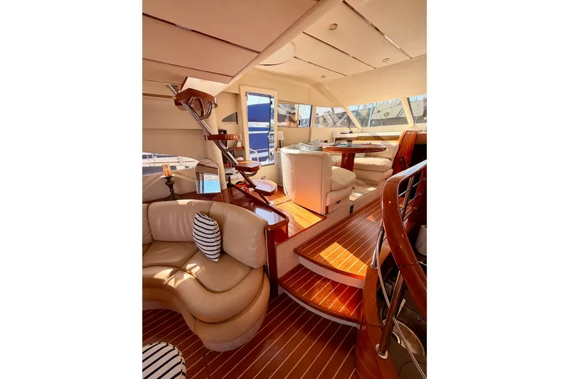 Slide: The Image of Luxurious interior of 2001 Fairline 55 yacht with elegant seating and wooden finishes. - 45