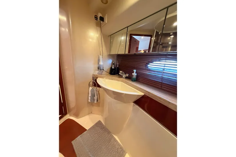 Slide: The Image of Luxurious bathroom interior of 2001 Fairline 55 yacht with modern sink and mirror. - 123