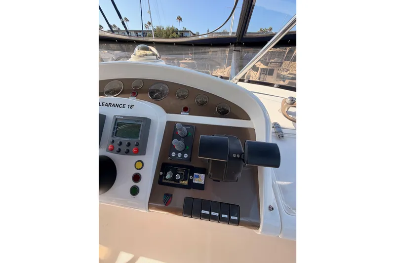 Slide: The Image of Helm of 2001 Fairline 55 yacht with navigation controls and gauges. - 72