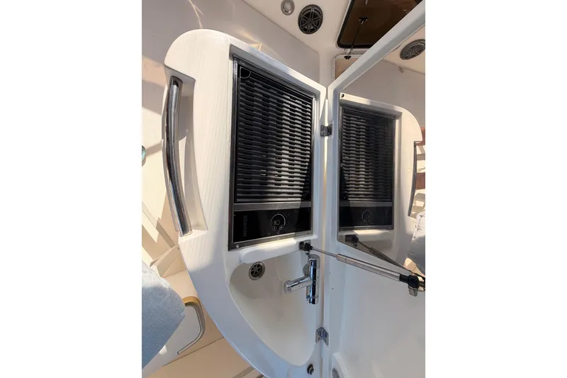 Slide: The Image of Outdoor kitchen area on a 2001 Fairline 55 yacht, featuring a grill and sink. - 68