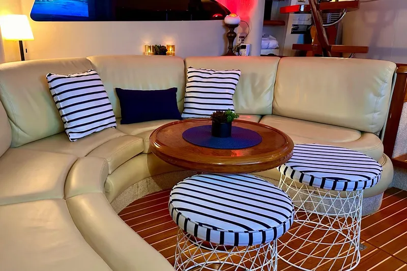 Slide: The Image of Luxurious 2001 Fairline 55 yacht interior with striped cushions and elegant seating area. - 142