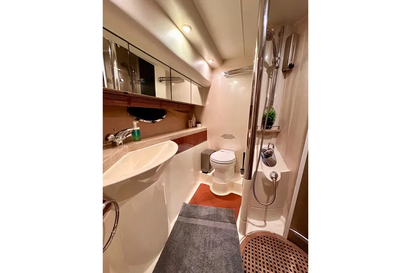Slide: The Image of Luxurious bathroom interior of 2001 Fairline 55 yacht, featuring modern fixtures and elegant design. - 147