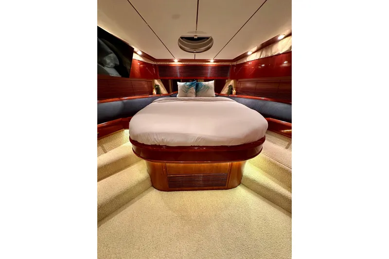 Slide: The Image of Luxurious cabin interior of a 2001 Fairline 55 yacht with elegant wood finishes. - 145