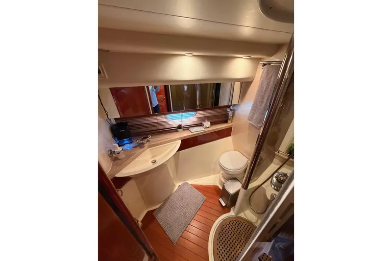 Slide: The Image of Luxurious bathroom interior of 2001 Fairline 55 yacht, featuring modern fixtures and elegant design. - 102