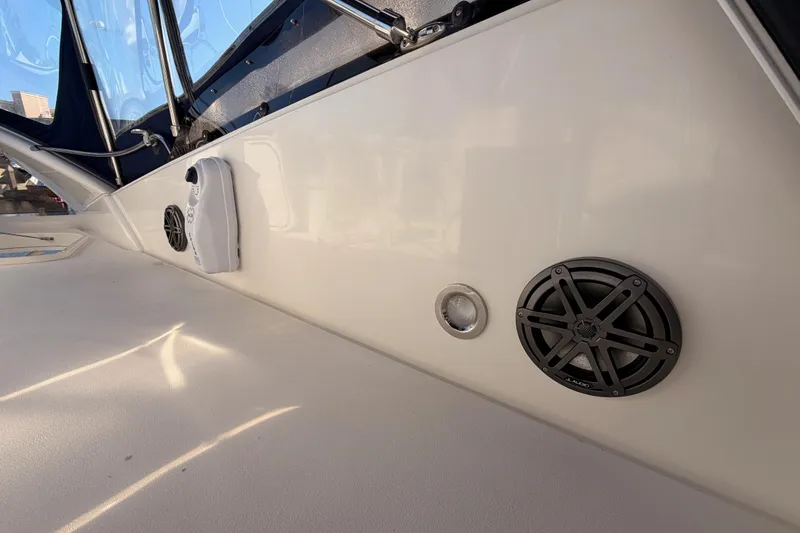 Slide: The Image of Interior view of a 2001 Fairline 55 yacht, featuring speakers and a control panel. - 78