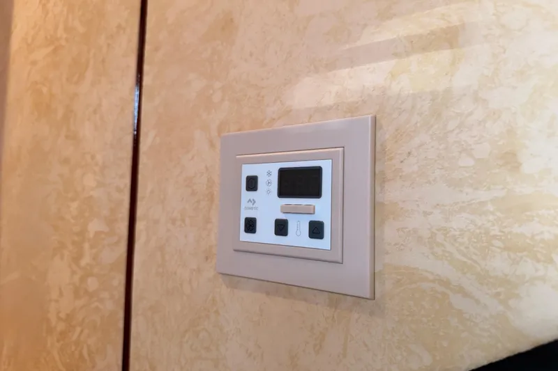 Slide: The Image of Control panel on a Fairline 55 yacht, 2001 model, mounted on a textured wall. - 110