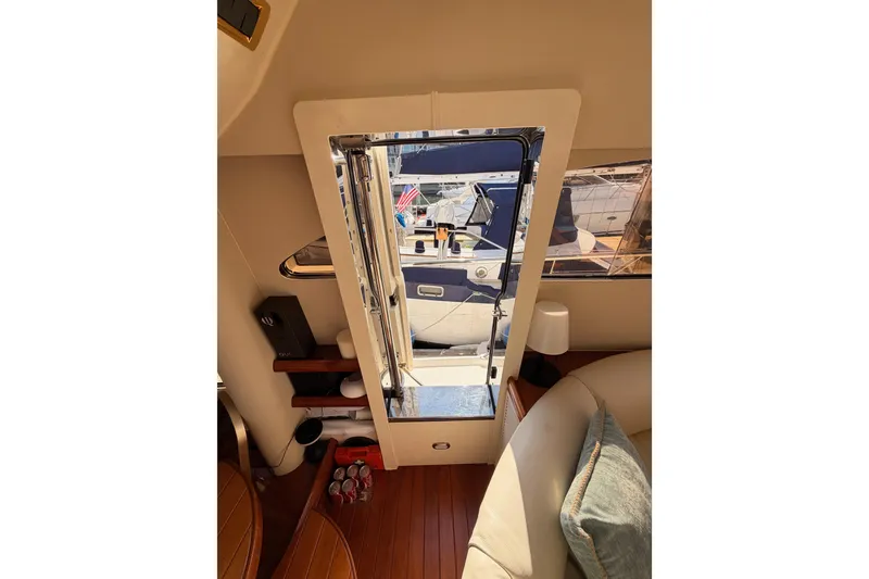 Slide: The Image of Interior view of a 2001 Fairline 55 yacht, showcasing elegant design and marina backdrop. - 47