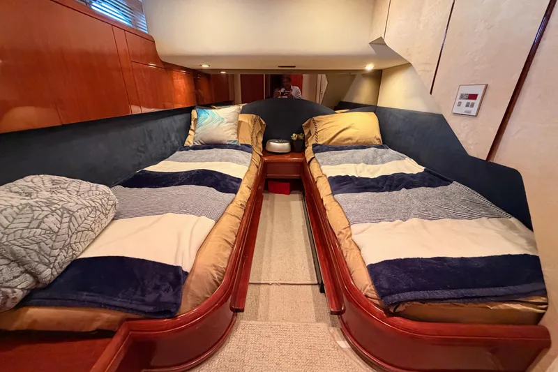 Slide: The Image of Interior of 2001 Fairline 55 yacht with twin beds and elegant wood finish. - 99