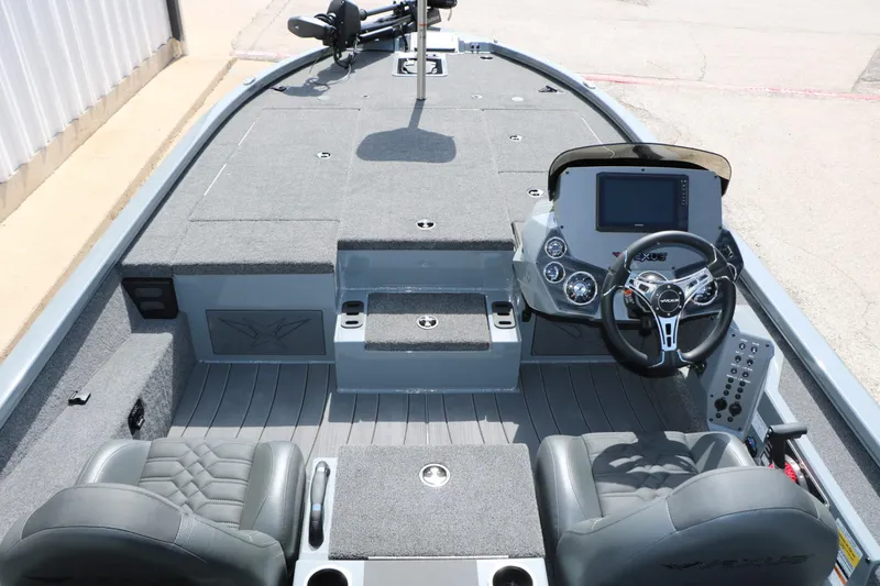 Slide: The Image of The image shows the cockpit of a Vexus AVX 1980 boat with gray seats and a modern helm. - 26