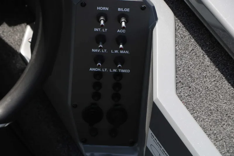 Slide: The Image of Close-up of a boat control panel with various switches and indicators. - 33