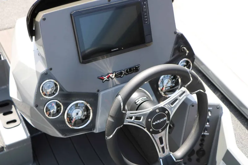 Slide: The Image of Dashboard of a Vexus AVX 1980 boat with steering wheel and instruments. - 32