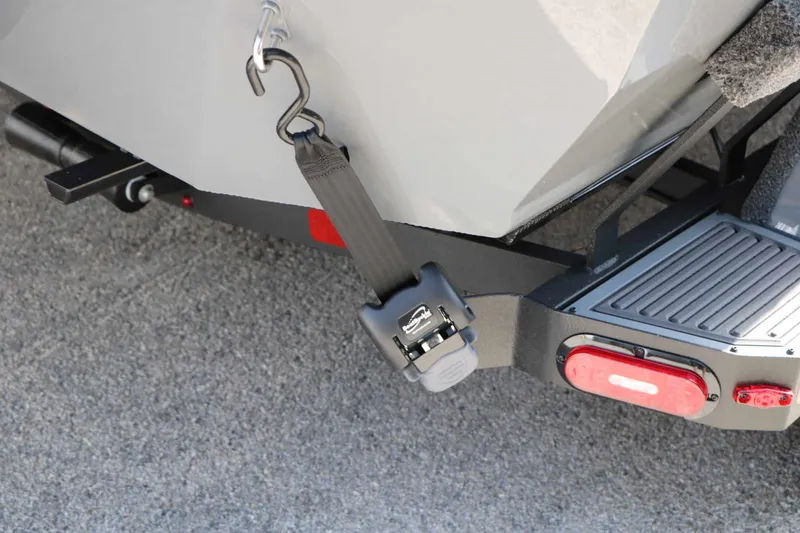 Slide: The Image of Close-up of a boat trailer with a safety strap and taillight. - 15