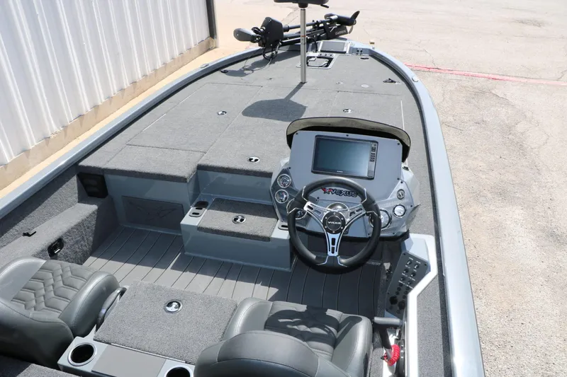 Slide: The Image of The image shows the cockpit of a 2026 Vexus AVX 1980 boat with gray seats and a modern helm. - 38