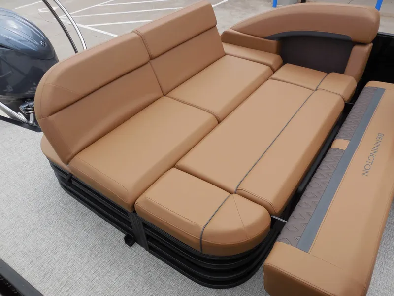 Slide: The Image of The image shows the brown leather seating of a 2026 Bennington 22MSB boat. - 22