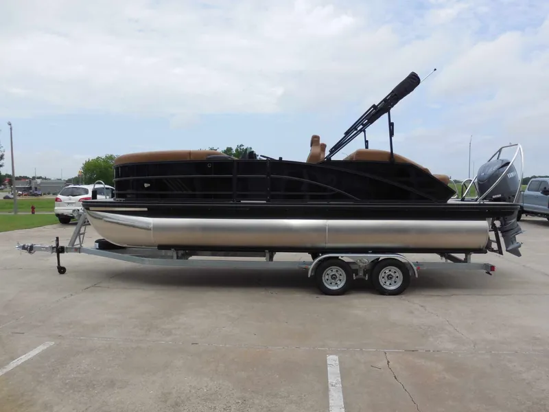 Slide: The Image of A sleek Bennington 22MSB pontoon boat on a trailer, ready for adventure. - 7