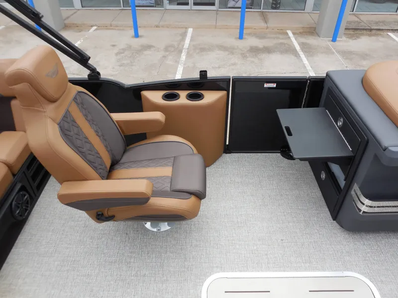 Slide: The Image of Interior of a Bennington 22MSB with a luxurious seat and storage area. - 19