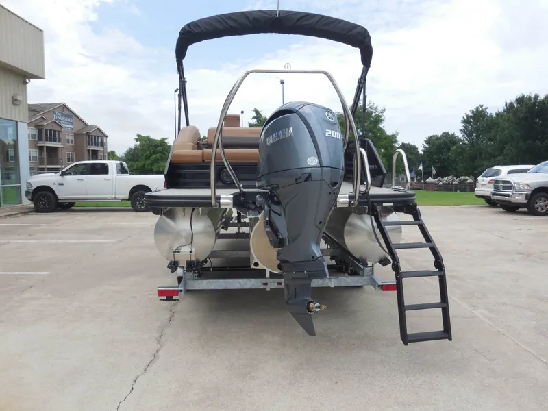 Slide: The Image of A Bennington 22MSB pontoon boat with a Yamaha 200 HP outboard motor on a trailer. - 5
